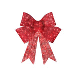 Illuminated red satin Christmas bowknot displayed against a festive background