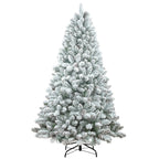 Multiple size flocked Christmas trees displayed together in a showroom
