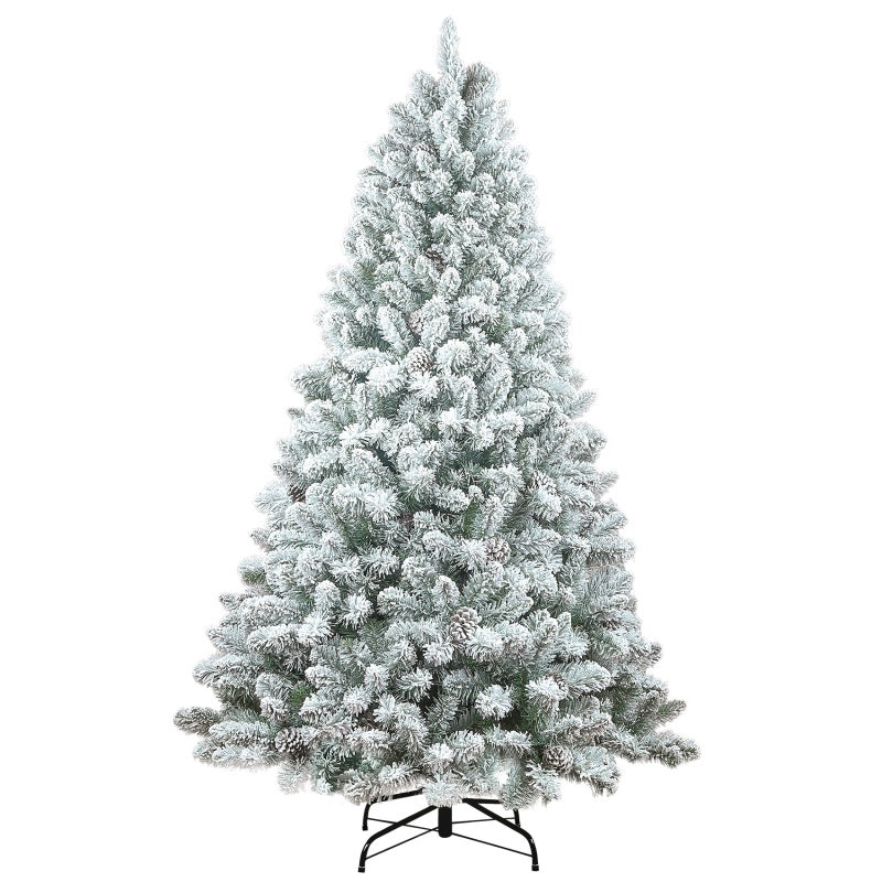 Multiple size flocked Christmas trees displayed together in a showroom