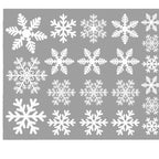 Close-up of delicate white snowflake static stickers for holiday window decoration