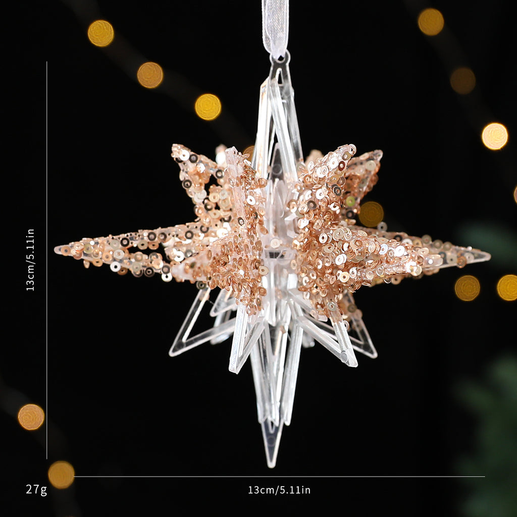 Champagne gold snowflake pendant catching light with shimmer effect