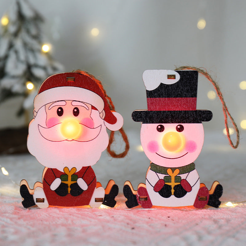 Wooden ornament hanging on decorated tree