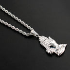 Close-up view of titanium steel praying hands pendant detail