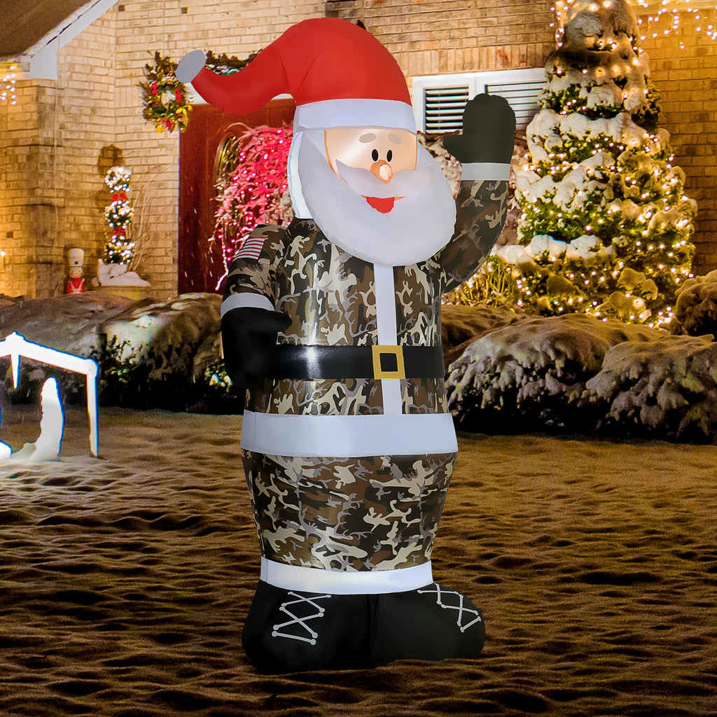 Eight-foot camo Santa Claus inflatable with warm white LED lights glowing in an outdoor setting - Christmas yard decor