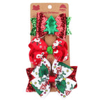 Three festive bow barrettes featuring Christmas-themed ribbon designs