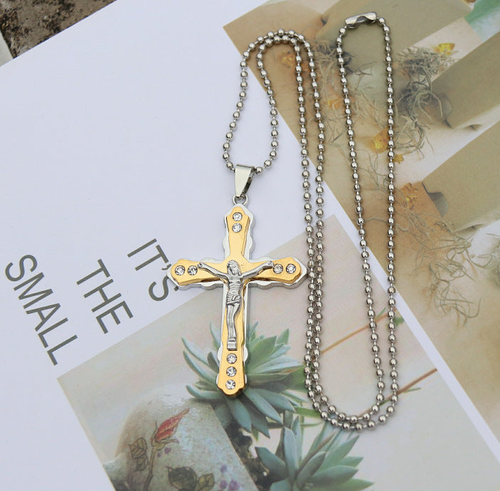 Jesus cross pendant resting on soft fabric, lifestyle shot