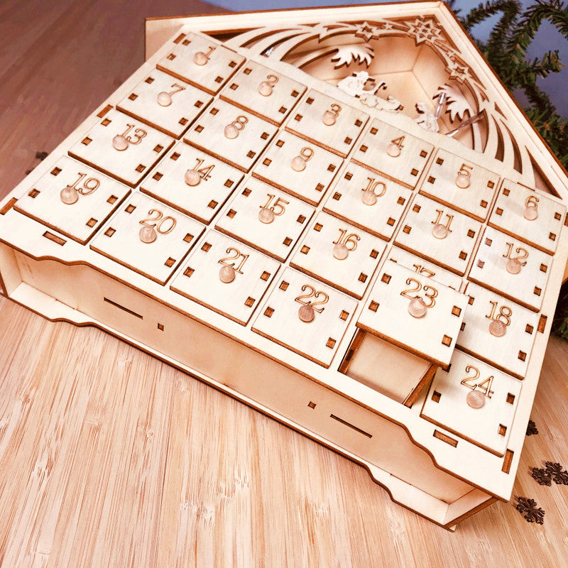 Wooden Christmas calendar displaying carved detailing and festive holiday design