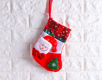 Festive seasonal display featuring sock ornaments among other decorations