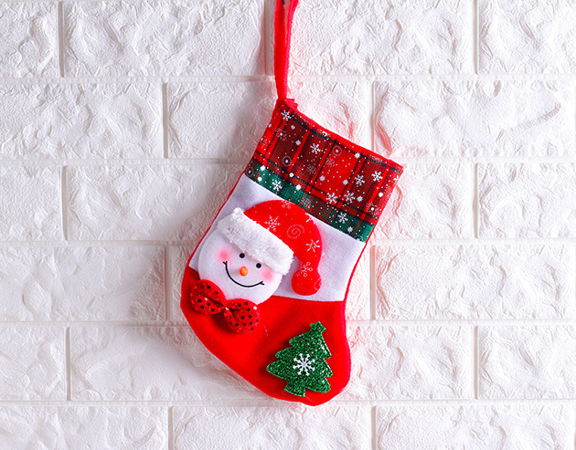 Festive seasonal display featuring sock ornaments among other decorations