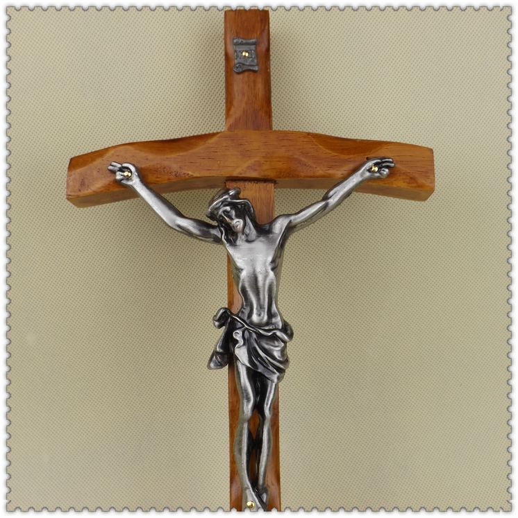 Decorative wooden cross wall piece with metal sacred figure