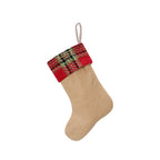 Set of three festive Christmas stockings in red and green displayed together