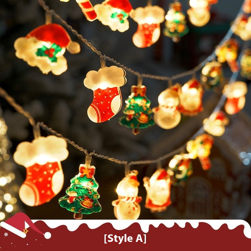 Close-up of colorful LED Christmas lights glowing warmly in dark setting