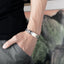 Stainless steel cross charm bracelet with rope chain design for men