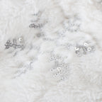 Holiday table decoration with sequin embellished bottle cover