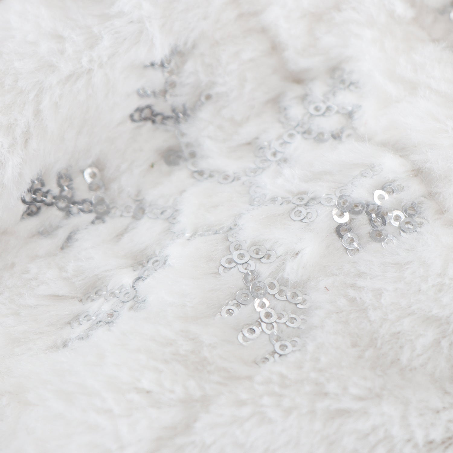 Holiday table decoration with sequin embellished bottle cover