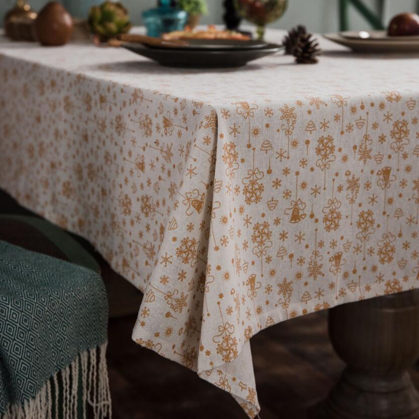 Festive table setting with Christmas red and gilded accents