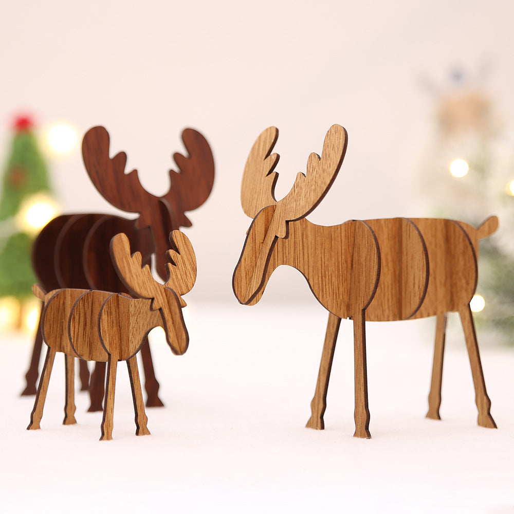 Multiple wooden elk ornaments hanging together creating a woodland Christmas display