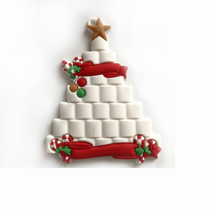 Close-up of personalized Christmas tree pendant with family theme
