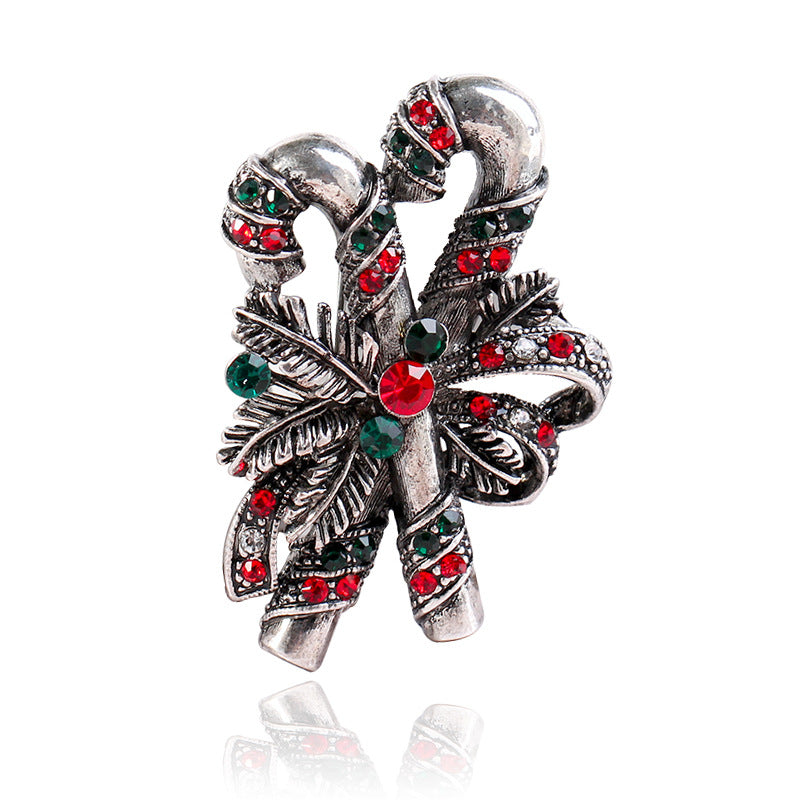 Christmas suit pin brooch displayed against dark background