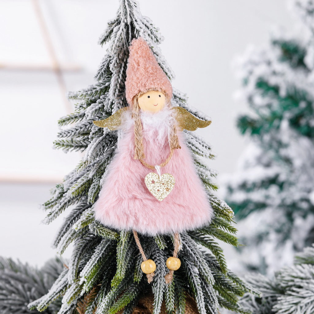 White plush Christmas tree pendant ornament hanging on tree branch