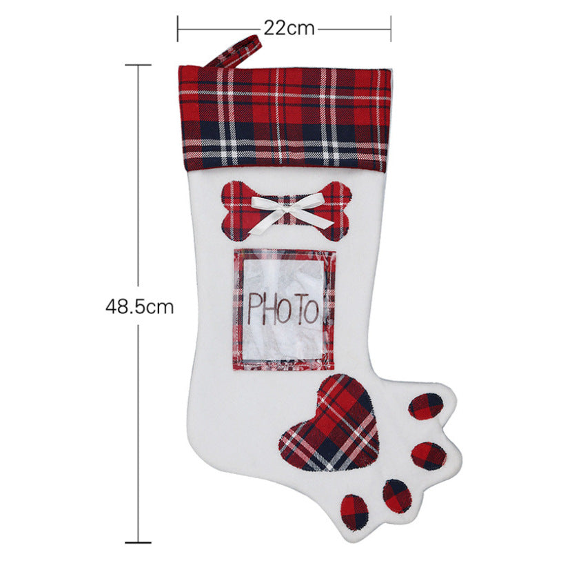 Christmas scene with dog paw stocking and festive ornaments