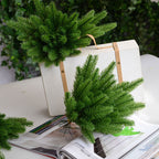 Close-up of textured pine needle decoration showing detailed green foliage on a sturdy stem