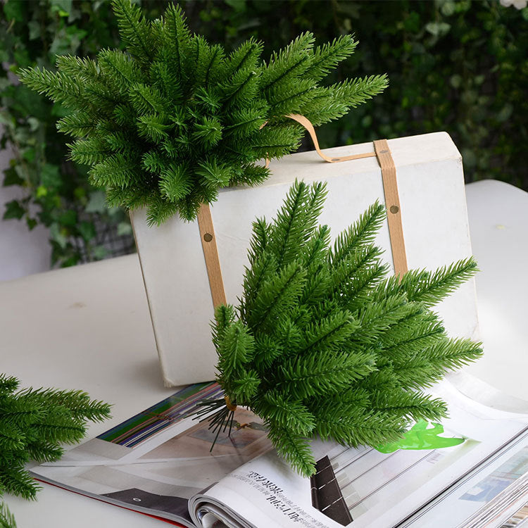 Close-up of textured pine needle decoration showing detailed green foliage on a sturdy stem