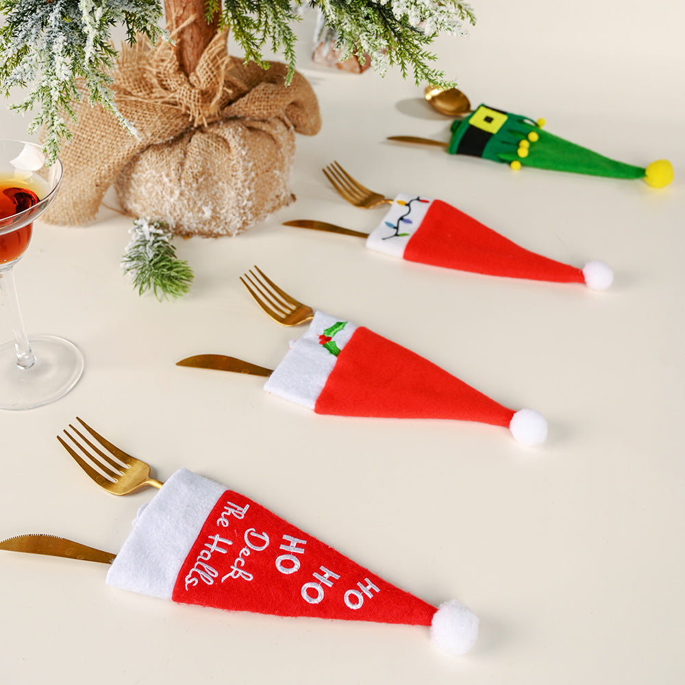 Holiday celebration table with festive hat and cutlery arrangement