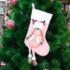 Cozy knitted fabric doll design on holiday gift bag