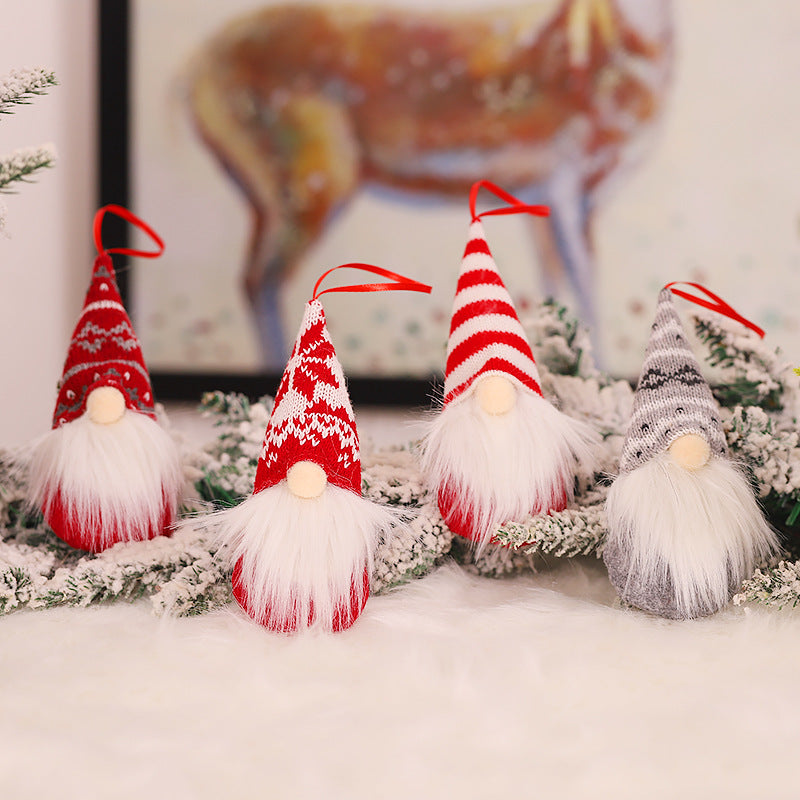 Rustic woodland Christmas gnome ornament displayed on frosted pine branches with red berries