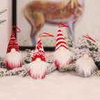 Rustic woodland Christmas gnome ornament displayed on frosted pine branches with red berries