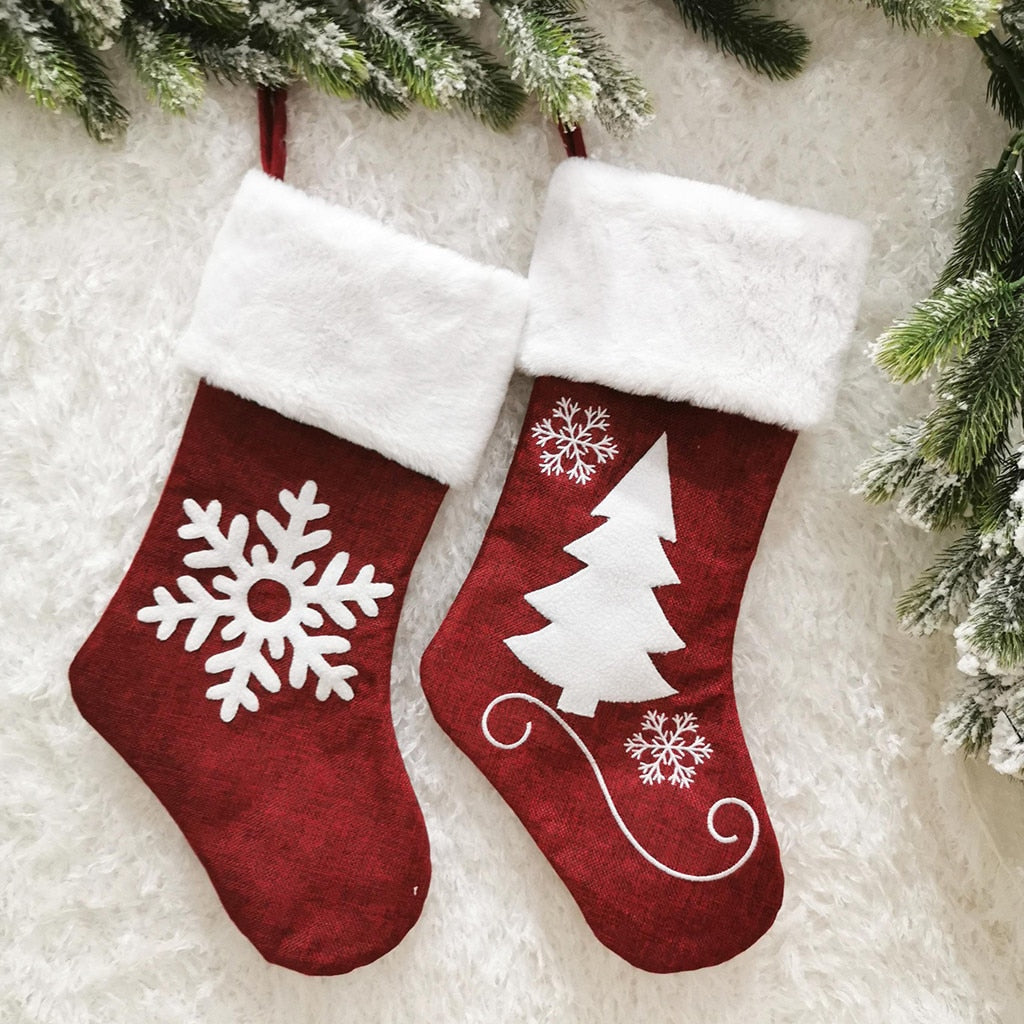 Set of Christmas sock gift bags in black and red colors for holiday gifting