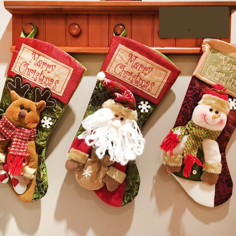Set of Christmas stockings showing three different holiday designs