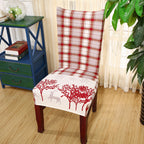 Set of Christmas chair covers with red grid pattern and holiday elk design