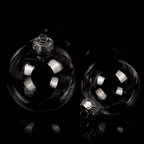 Transparent Christmas balls hanging on a decorated tree