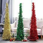 Beautiful sequin Christmas tree standing tall in home entryway
