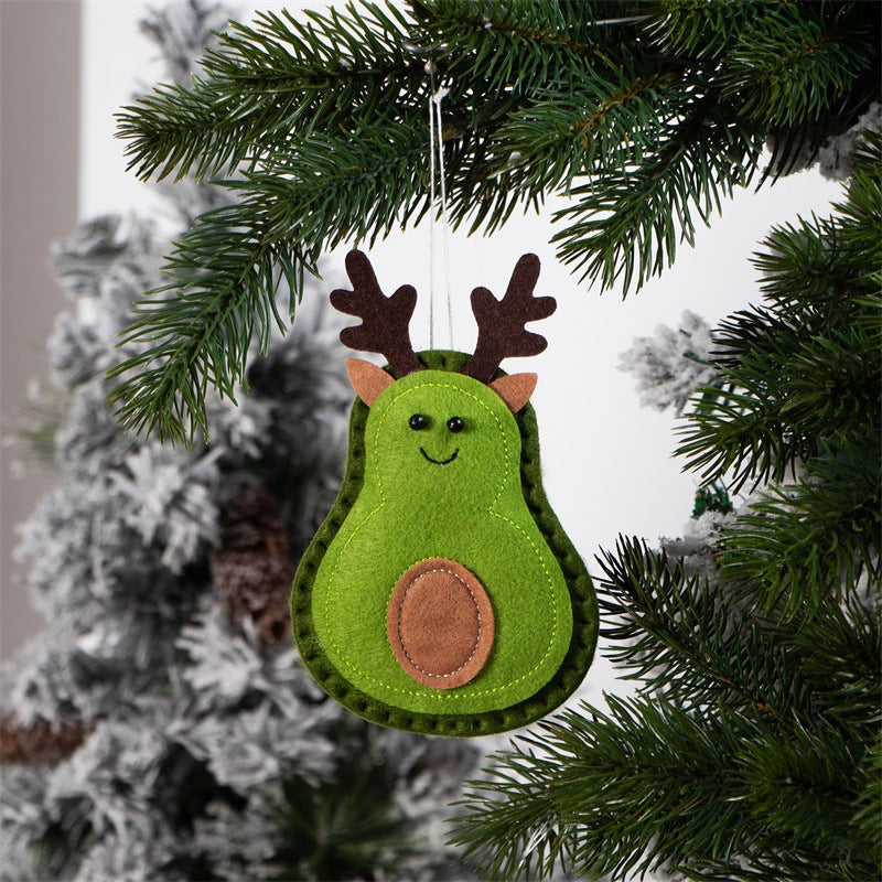 Three felt tree pendants hanging on a Christmas tree branch