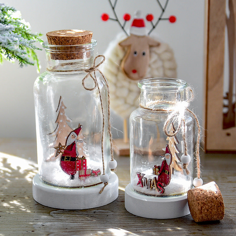 Christmas tabletop decoration with snow-filled bottle design