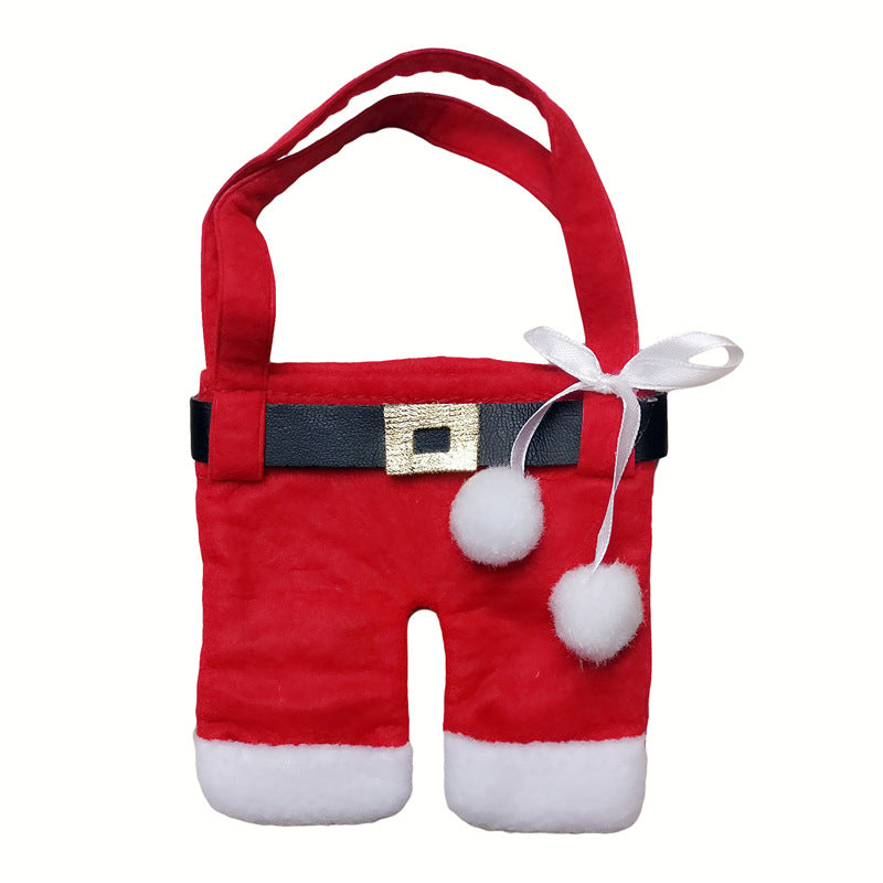 Red Christmas napkin holder set shaped like folded clothes on table