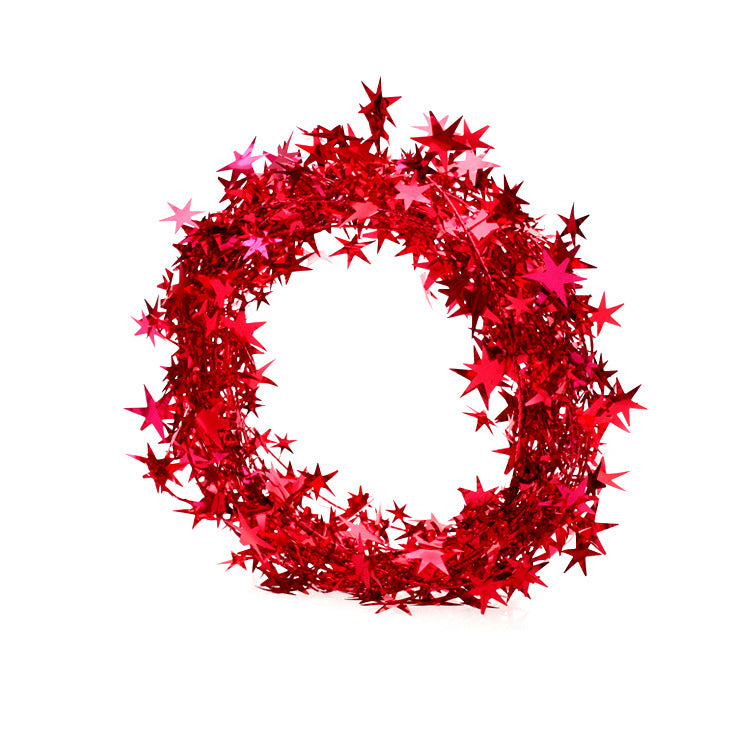 Green pine garland with decorative star ornaments for doorways