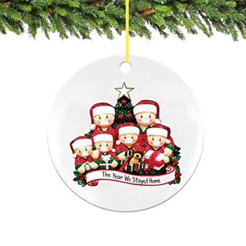 Christmas tree ornament pendant in festive holiday setting with red berries and greenery