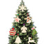 Rustic unfinished wooden Christmas tree pendant on warm wooden surface with craft paints nearby