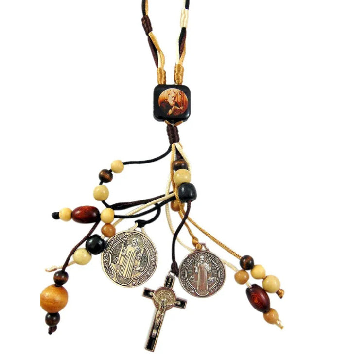 St Benedict Medal and Cross pendant with warm lighting