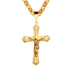 Golden cross necklace pendant with smooth finish, capturing quiet devotion