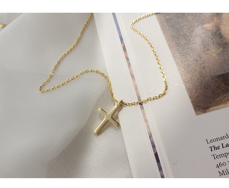 Model wearing 925 Sterling Silver cross pendant necklace in lifestyle setting