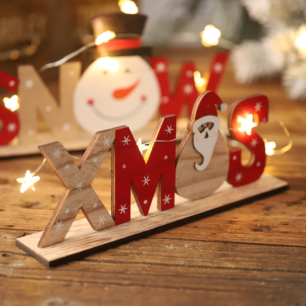 Wooden Christmas ornaments displayed on tree ready for gifting as meaningful faith-inspired Christmas gift