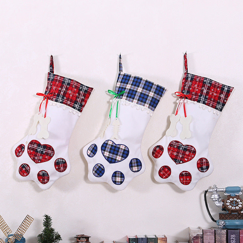 Dog paw Christmas stocking hanging by fireplace for holiday display