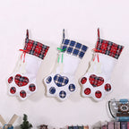 Dog paw Christmas stocking hanging by fireplace for holiday display