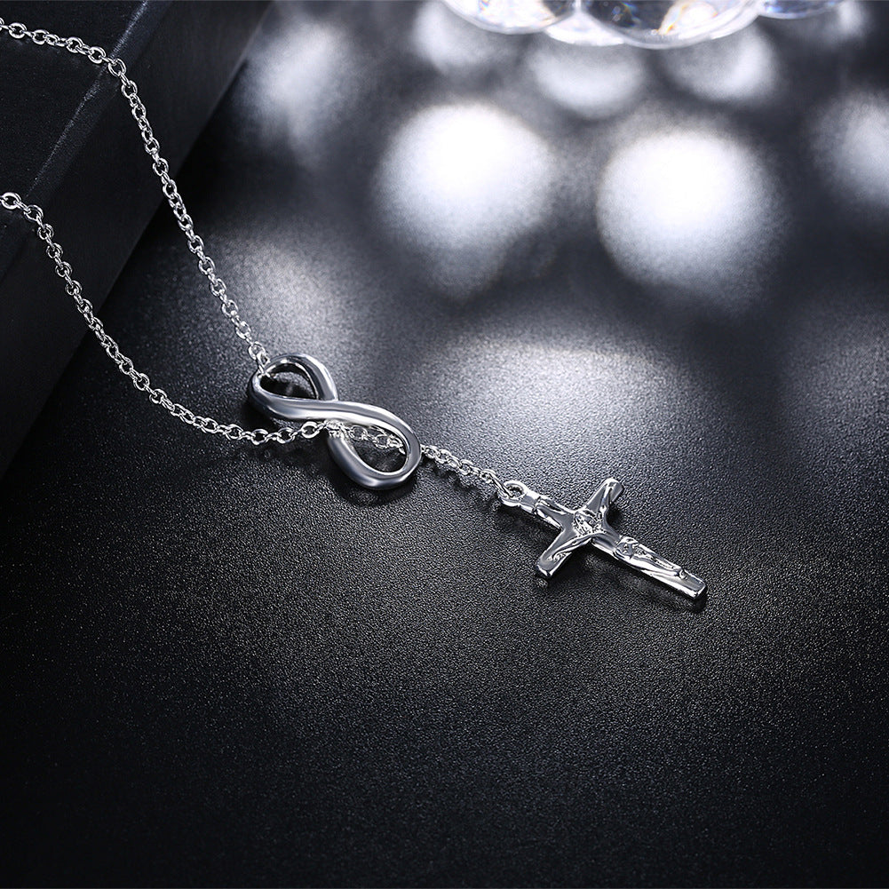 Multiple angles of copper cross pendant necklace