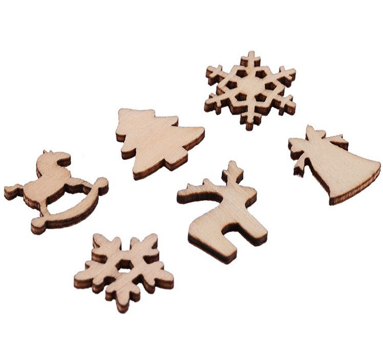 Christmas tree decorated with carved plywood wood chip ornaments
